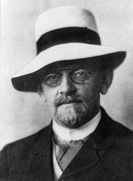 Portrait photograph of David Hilbert wearing his characteristic hat.