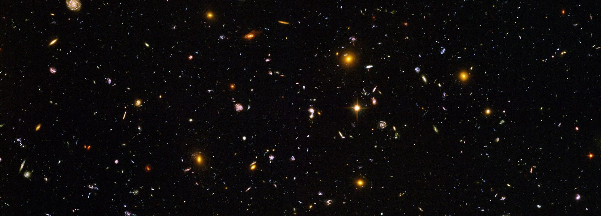 The Hubble Ultra Deep Field — thousands of galaxies scattered across the dark of space.